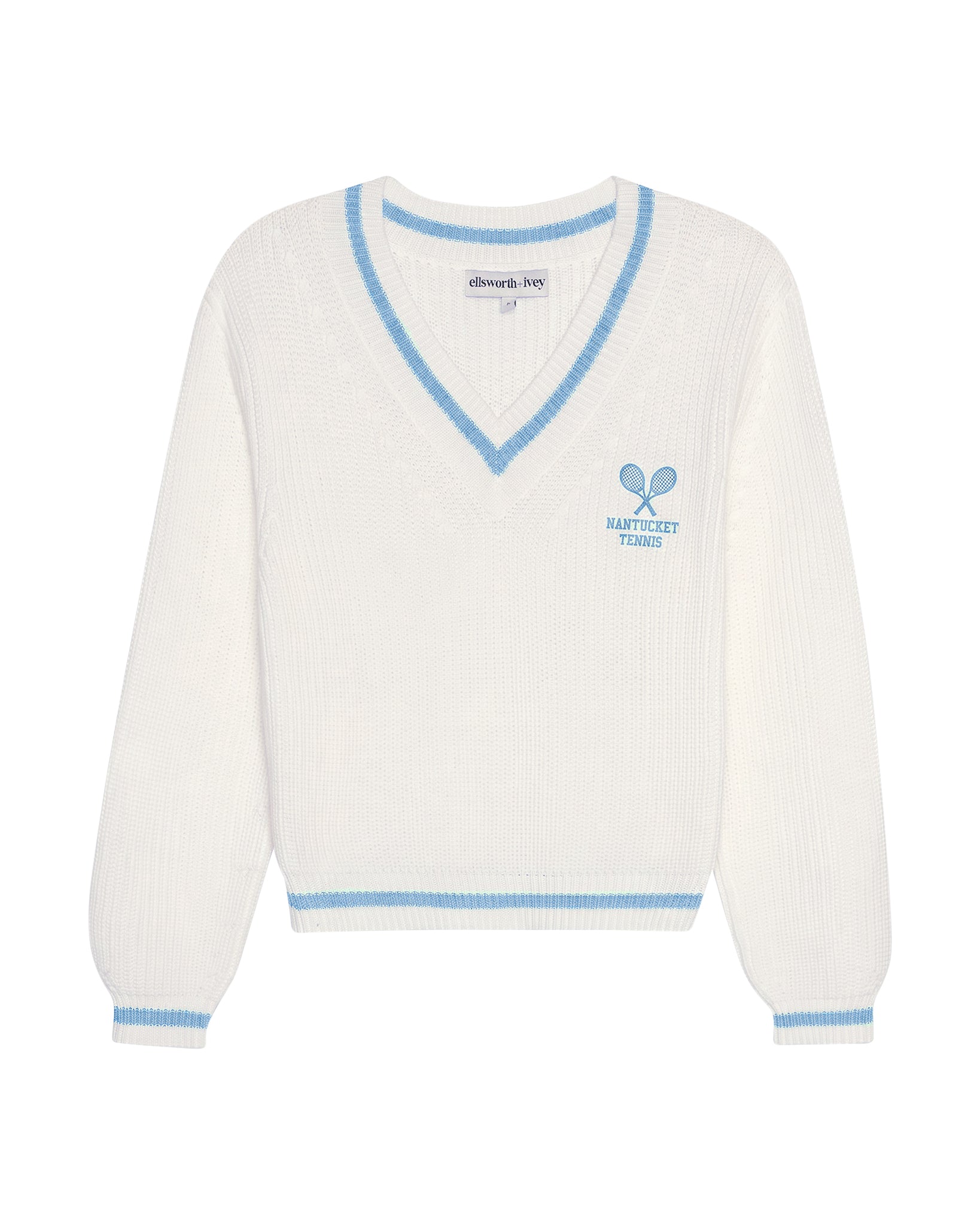 An off-white ivory ribbed knit cropped women's sweater with blue trim on a V-neck collar, cuffs, and hem, featuring a blue tennis racket graphic on the left chest. Brooke Varsity - Nantucket by Ellsworth + Ivey.