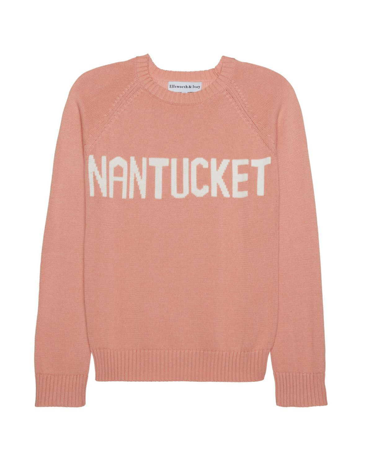 A salmon peach pink knit crewneck sweater with 'NANTUCKET' written across the chest in white capital letters, shown flat on a white background. Classic Crew Sweater- Nantucket by Ellsworth + Ivey.
