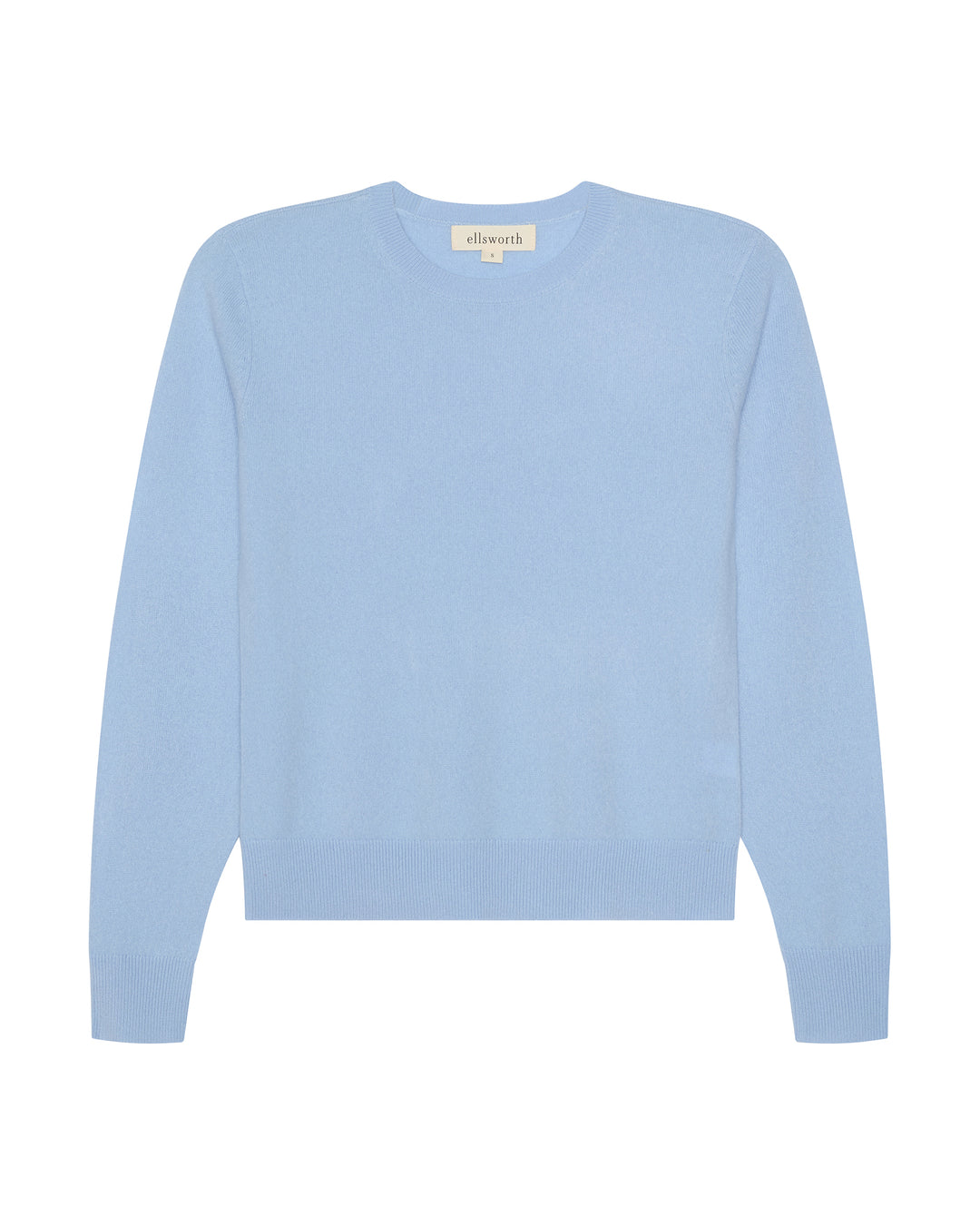 A light blue crewneck cashmere women's sweater with long sleeves and ribbed cuffs and hem, displayed flat against a solid white background. Daphne Crew Sweater in Sky Blue by Ellsworth + Ivey.