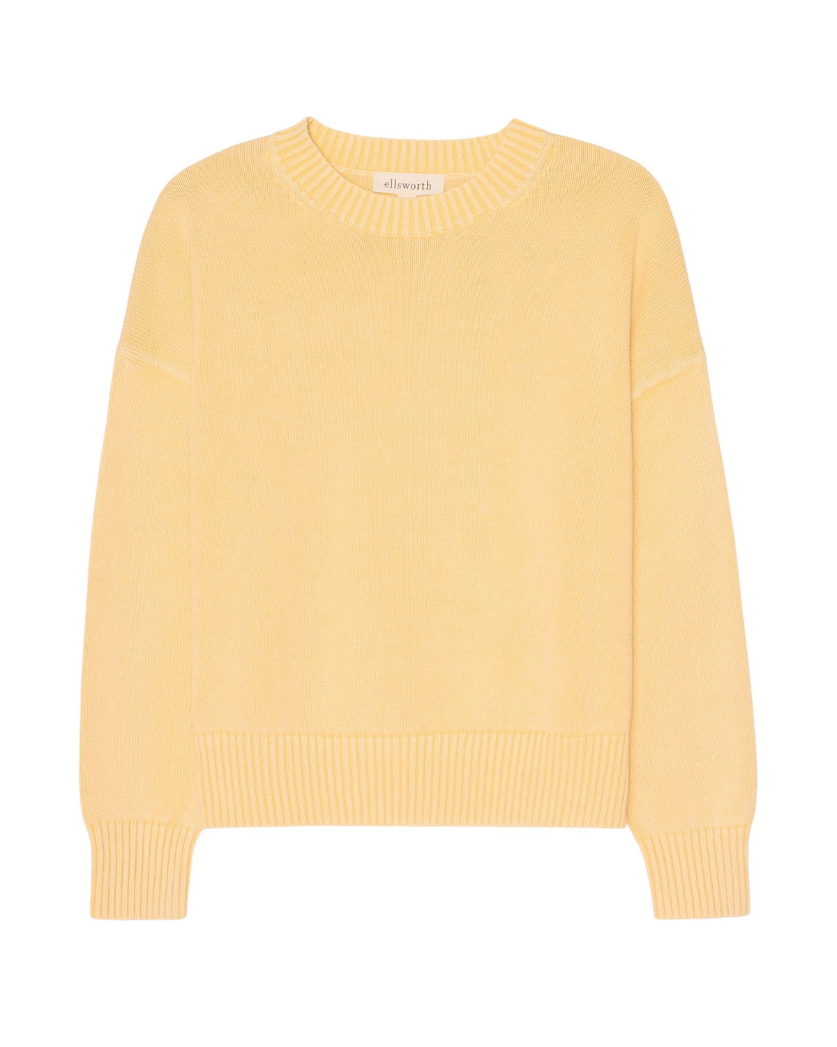 A pale yellow crewneck knit women's sweater with ribbed cuffs and hem, displayed flat against a white background. Emery Crewneck Sweater in Butter Yellow by Ellsworth & Ivey.
