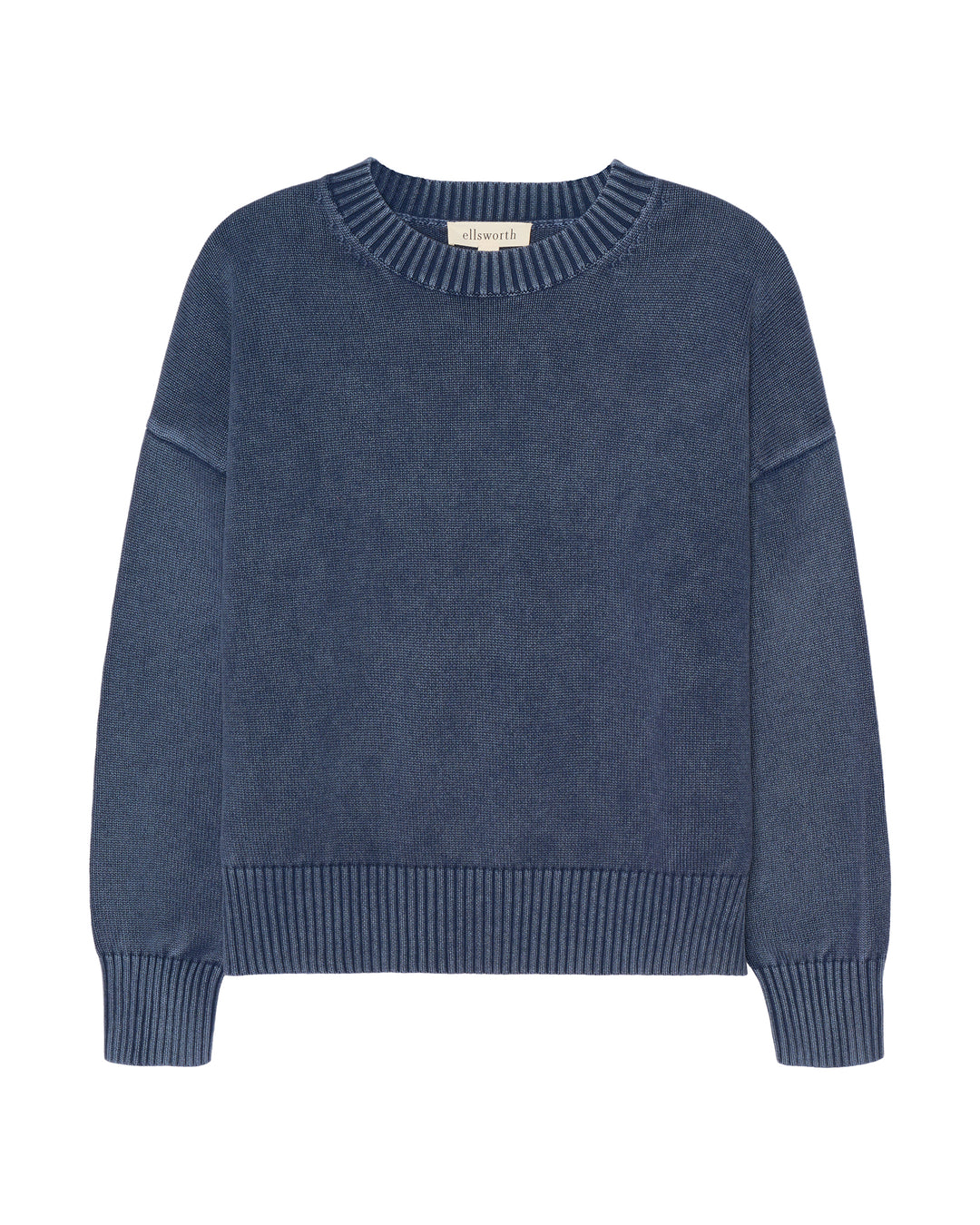 An acid wash dark navy blue knit women's crewneck sweater with ribbed trim on the collar, cuffs, and hem, displayed flat against a white background. Emery Crewneck Sweater by Ellsworth & Ivey. 