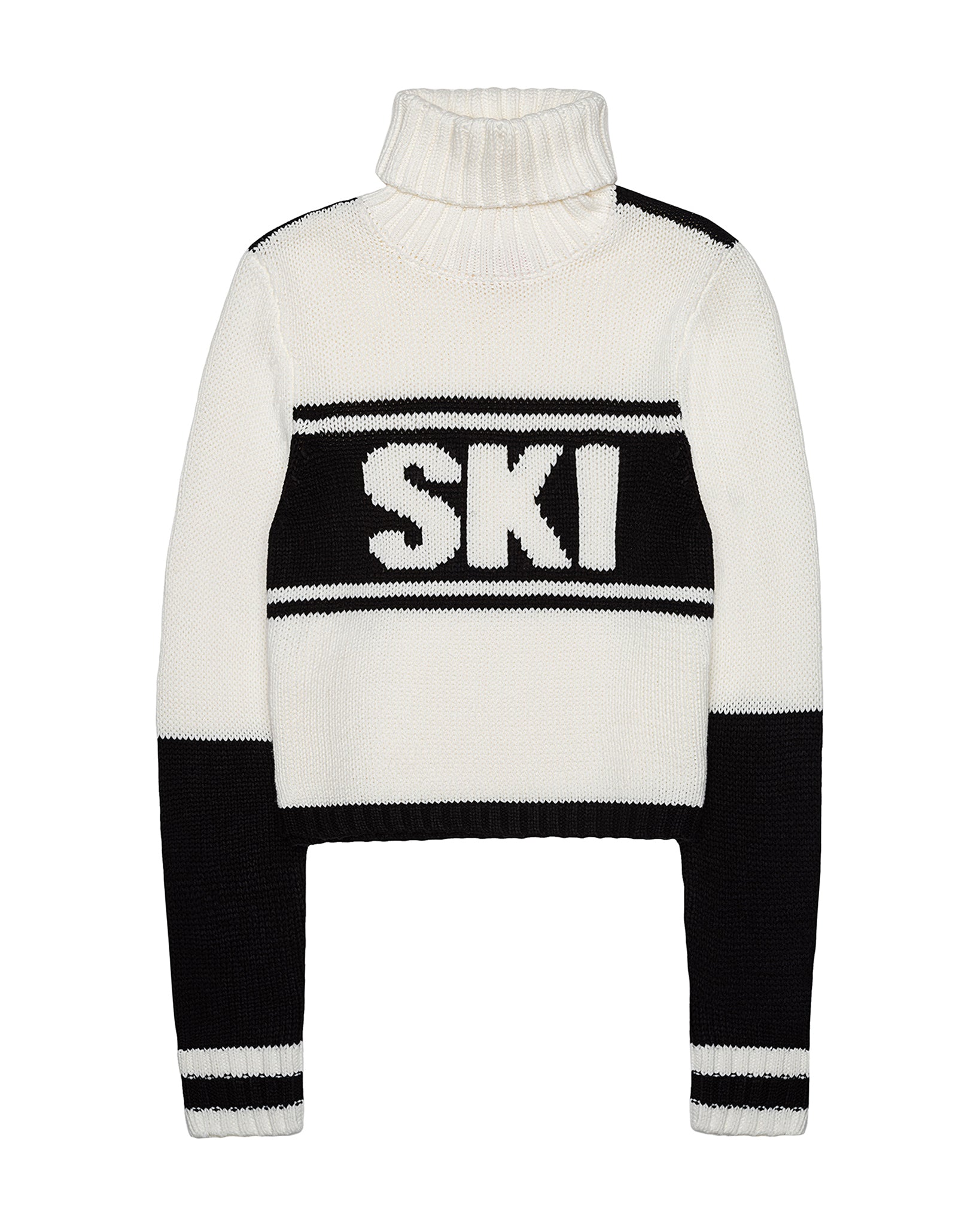 A cropped knit turtleneck sweater in white and black, featuring the word 'SKI' in large white letters across a black horizontal band on the chest. Jade Turtleneck- Ski in Ivory Black by Ellsworth + Ivey.