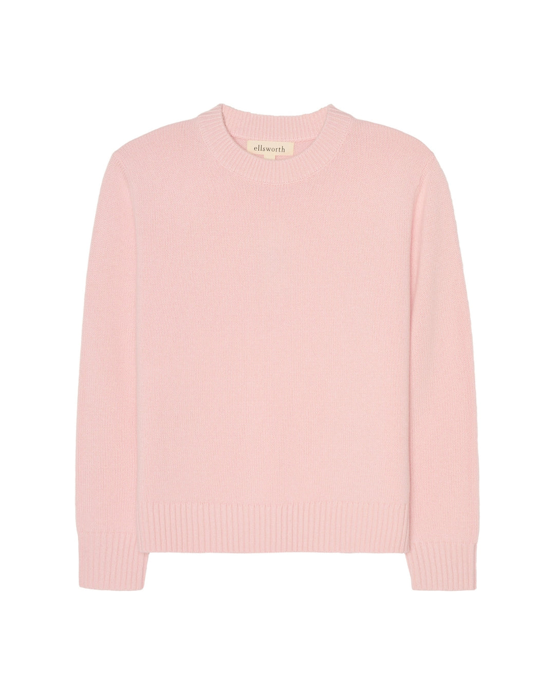 A light pink women's crewneck sweater with long sleeves and ribbed cuffs and hem, shown against a plain white background. Joey Crew in Pastel Pink by Ellsworth + Ivey.