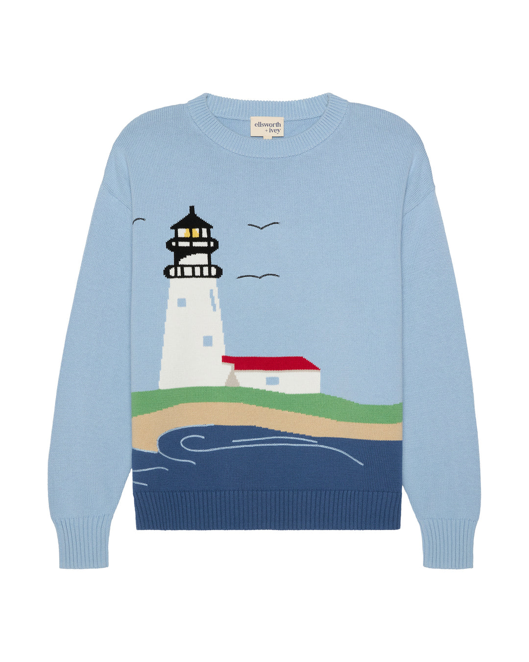 A light blue crewneck women's sweater featuring a knitted graphic of a Nantucket lighthouse, a small red-roofed building, birds, and stylized waves on a blue background. Riley ACK Lighthouse Scenery Sweater by Ellsworth + Ivey.