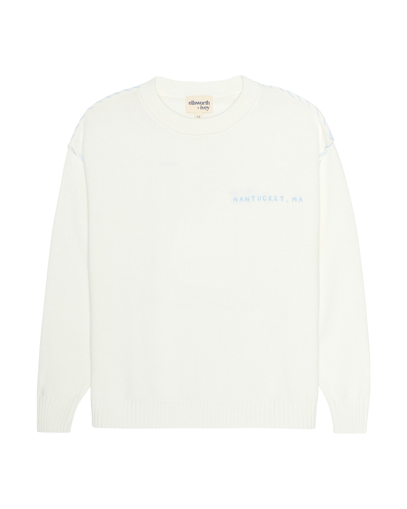An ivory off-white crewneck sweater with 'Nantucket, MA' printed in light blue on the left chest, displayed against a solid white background. Riley Crew Sweater - ACK Nantucket Lobster by Ellsworth + Ivey.