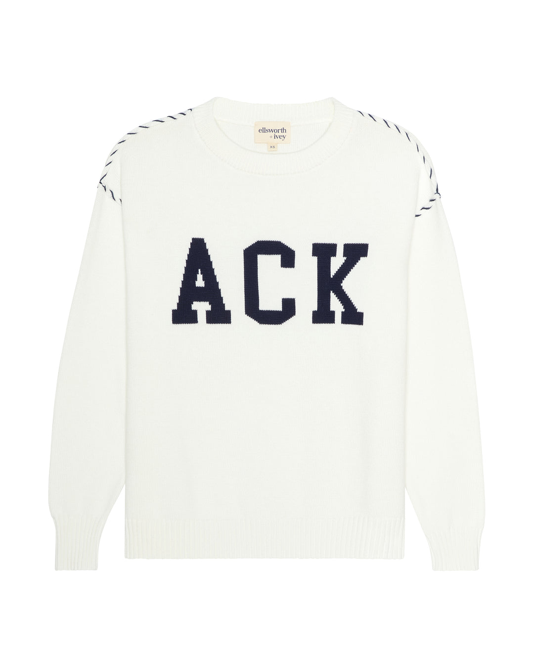 An ivory white crewneck sweater featuring the letters 'ACK' in large navy blue varsity block font across the chest, with white contrast whip stitching along the shoulders, shown on a plain white background. Riley Crew Sweater - ACK Nantucket by Ellsworth + Ivey.