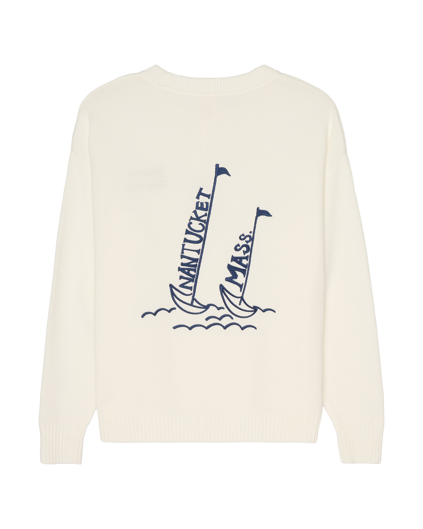 An ivory crewneck women's sweater featuring a navy blue graphic of two sailboats on the front, with 'NANTUCKET' and 'MASS.' embroidered vertically on the sails. Riley Crew Sweater - ACK Sailing by Ellsworth + Ivey.