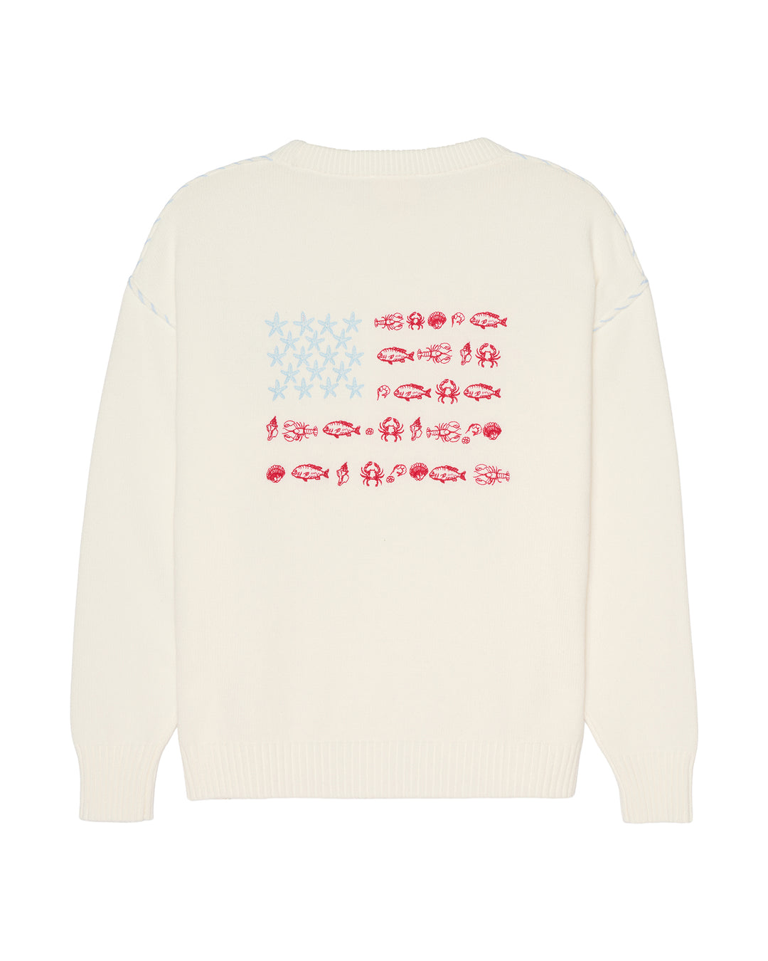 An ivory crewneck sweater shown from the back, featuring a graphic print of the American flag made from fish silhouettes in red and light blue. Ellsworth + Ivey Riley Stars and Shells Flag Sweater.