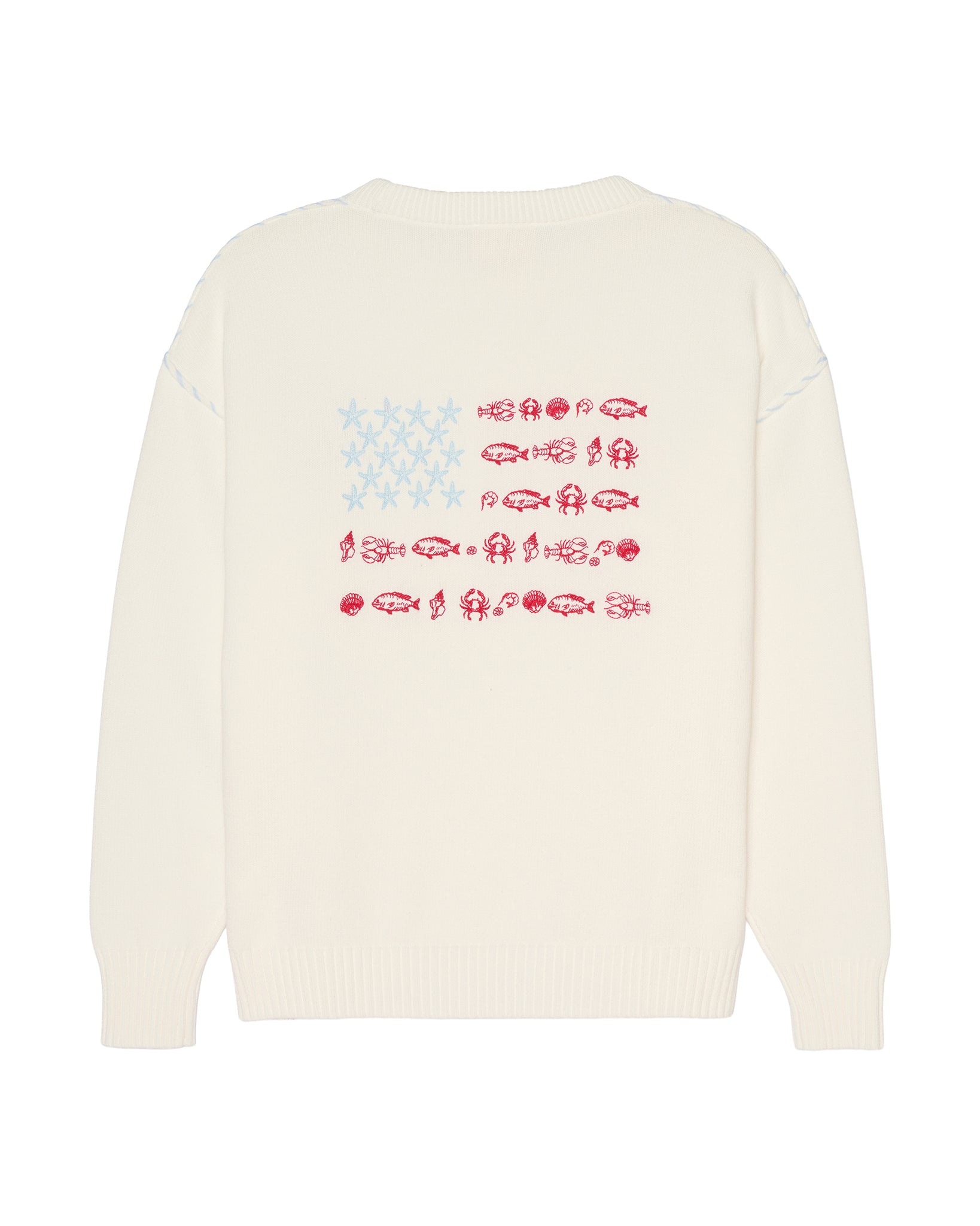 An ivory crewneck sweater shown from the back, featuring a graphic print of the American flag made from fish silhouettes in red and light blue. Ellsworth + Ivey Riley Stars and Shells Flag Sweater.