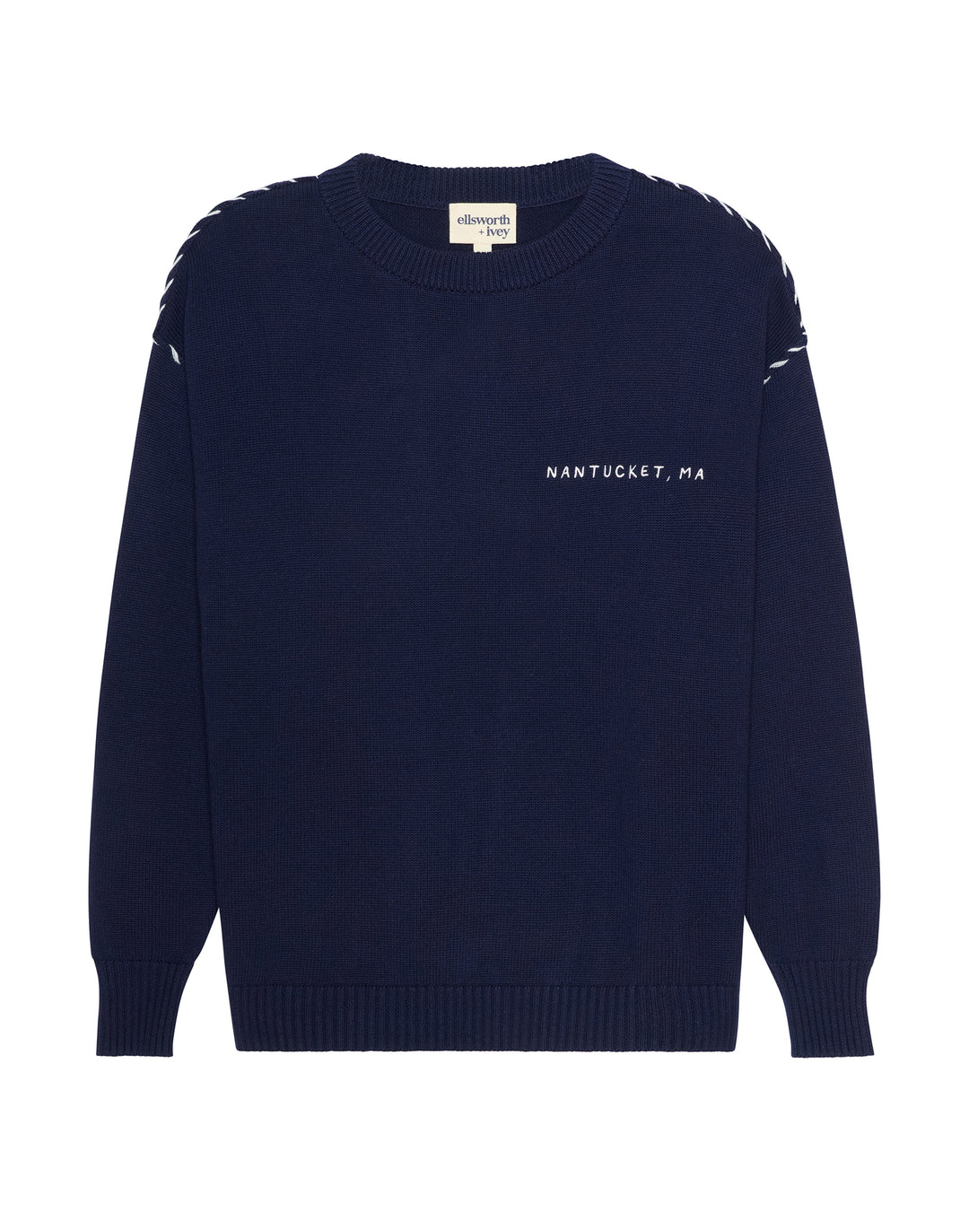 A navy blue crewneck sweater with white embroidered details, featuring &