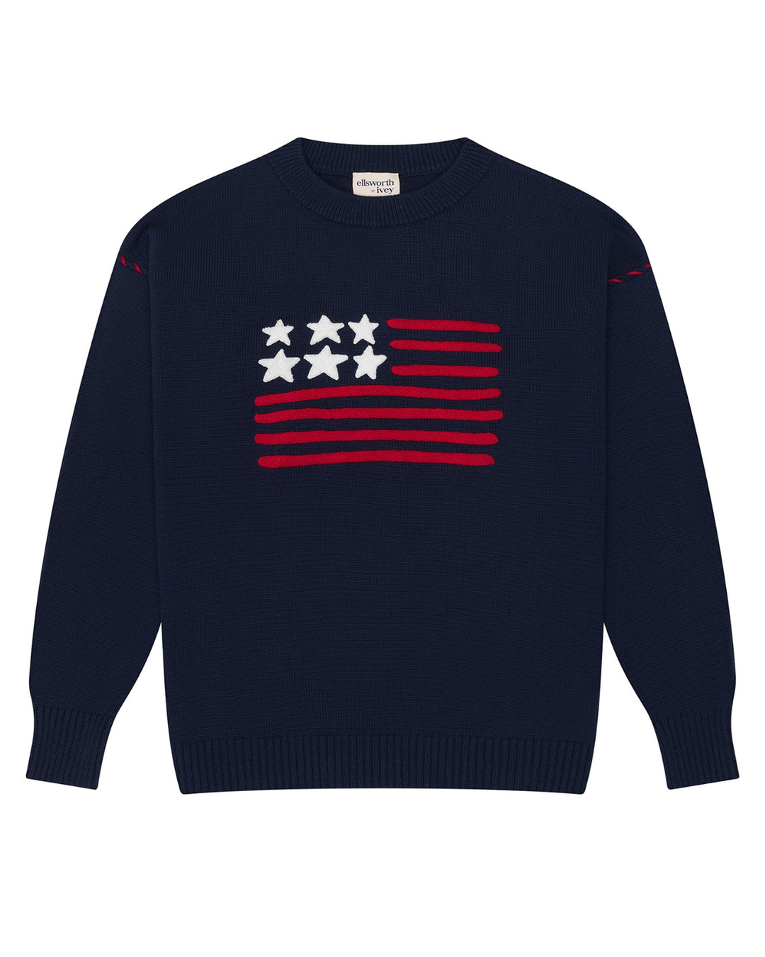 A navy blue crewneck women's sweater featuring a stylized American flag graphic on the chest with red stripes and white stars, displayed on a clean white background. Riley Crew - American Flag by Ellsworth + Ivey.