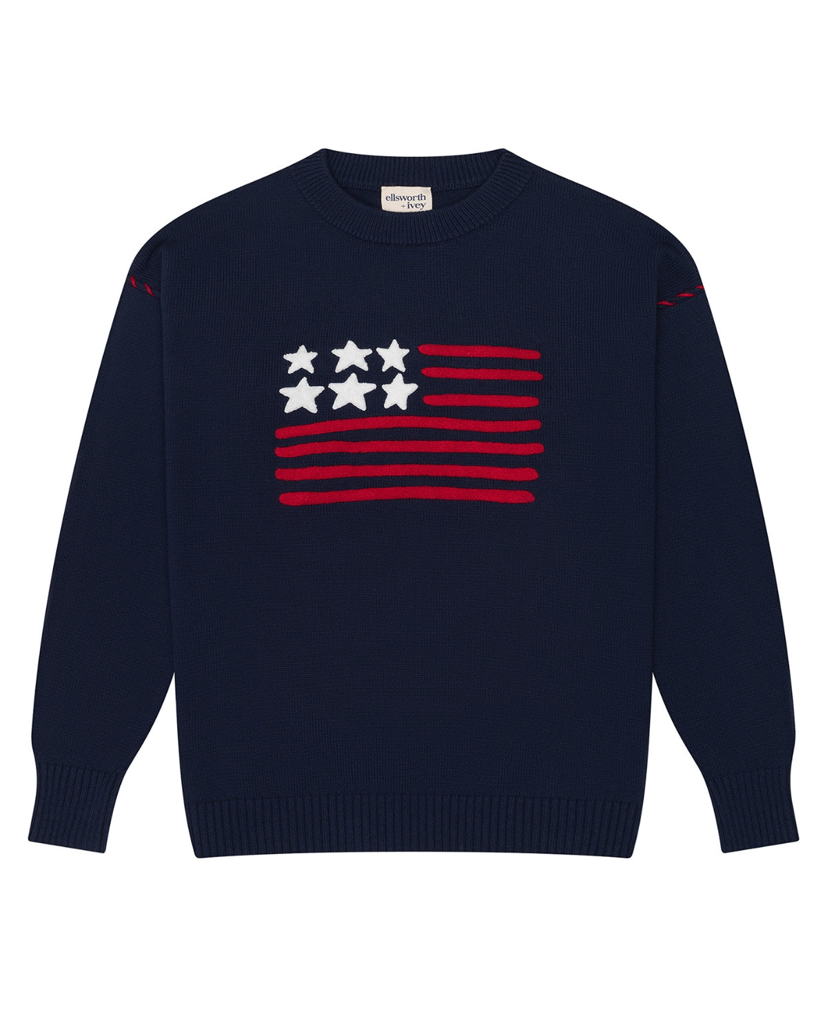 A navy blue crewneck women's sweater featuring a stylized American flag graphic on the chest with red stripes and white stars, displayed on a clean white background. Riley Crew - American Flag by Ellsworth + Ivey.