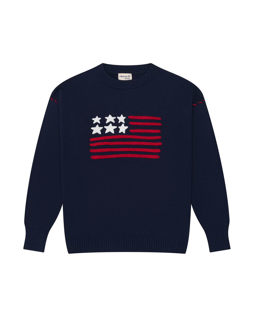 A navy blue crewneck women's sweater featuring a stylized American flag graphic on the chest with red stripes and white stars, displayed on a clean white background. Riley Crew - American Flag by Ellsworth + Ivey.