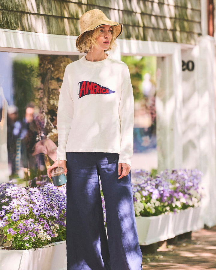 A woman in an ivory off-white crewneck women&
